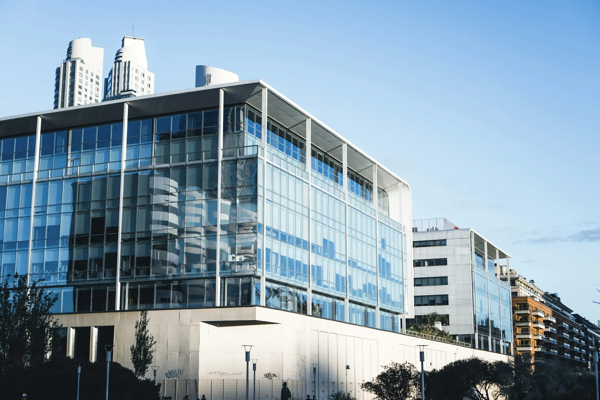 Glass office building on a bright day